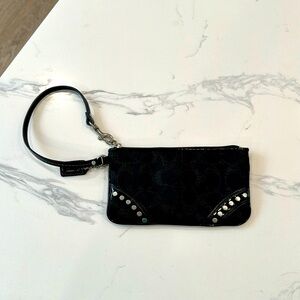 Coach wristlet black signature black leather trim studded silver detail.
